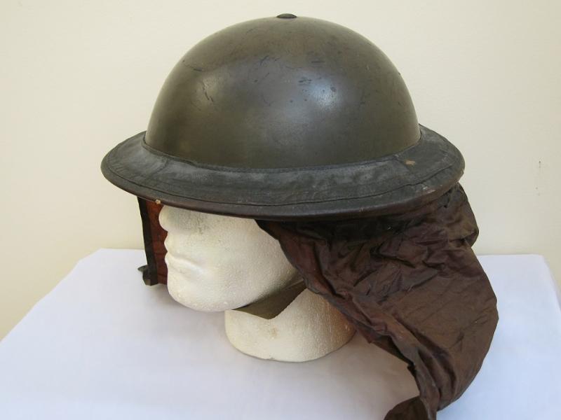 WWII British Army Steel Combat Helmet Dated 1938, and Gas Hood cover.
