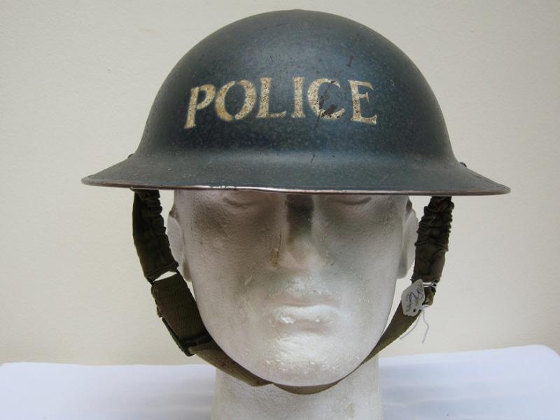 A nice early example of British WWII Bobby Brodie Helmet dated 1938 with original chinstrap and liner