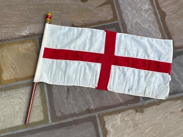 AN ORIGINAL VINTAGE ST GEORGE CROSS STITCHED FLAG USED ON SMALL BOATING VESSEL.