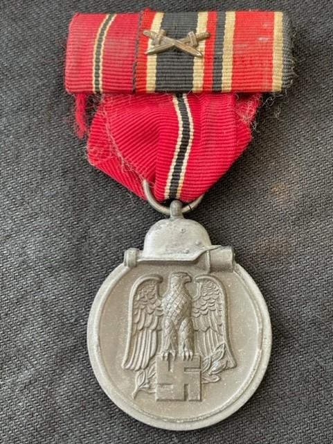 NICE GERMAN WWII RUSSIAN FRONT MEDAL WITH MEDAL RIBBON BAR ATTACHED.