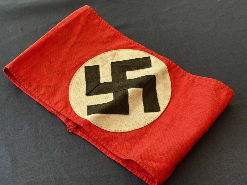 WWII GERMAN NSDAP SWASTIKA PARTY ARMBAND WITH RZM PAPER TAG INSIDE.