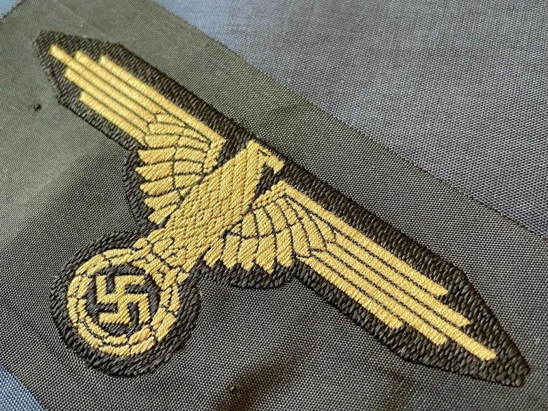 WWII GERMAN WAFFEN SS ARM EAGLE WITH SS PAPER ISSUED RZM TAG REMAINING.